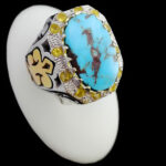 انگشتر فیروزه نیشابوری دست ساز فاخر نقره مردانه طرح دور طلایی بوشیتا