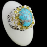 انگشتر فیروزه نیشابوری دست ساز فاخر نقره مردانه طرح دور طلایی هیوا