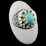 انگشتر فیروزه نیشابوری نقره دست ساز فاخر مردانه طرح دور طلایی رادمان