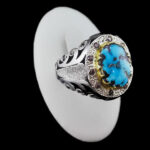 انگشتر فیروزه نیشابوری نقره دست ساز فاخر مردانه طرح دور طلایی هوراد